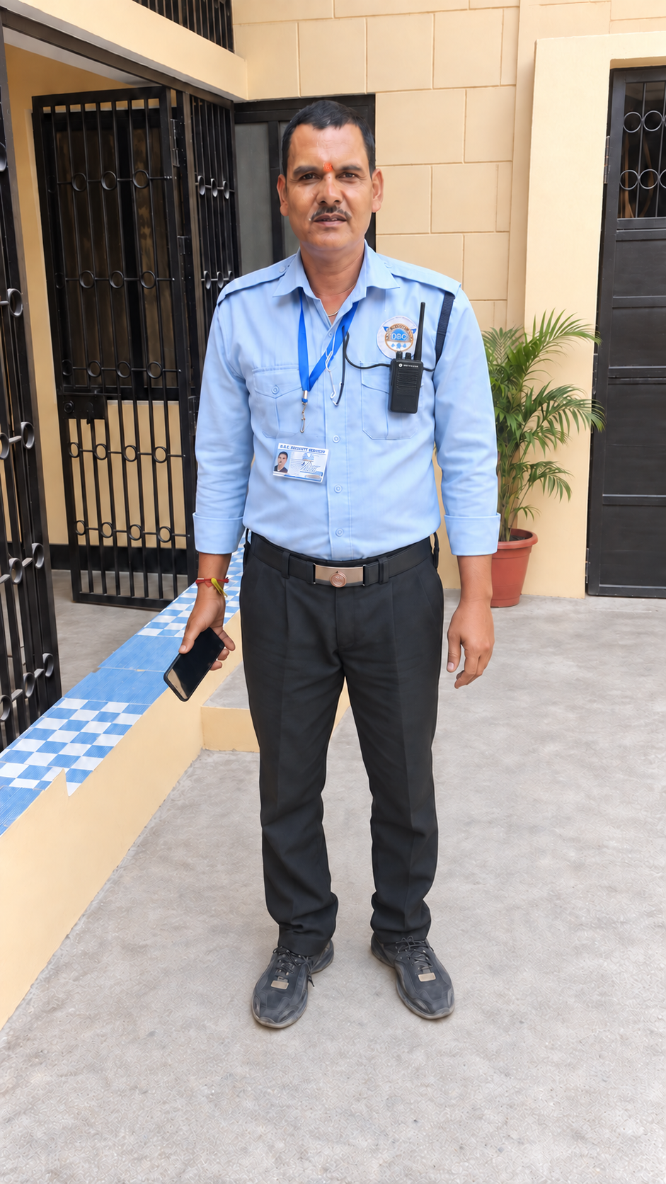 DBC security officer with a walkie-talkie on residential duty