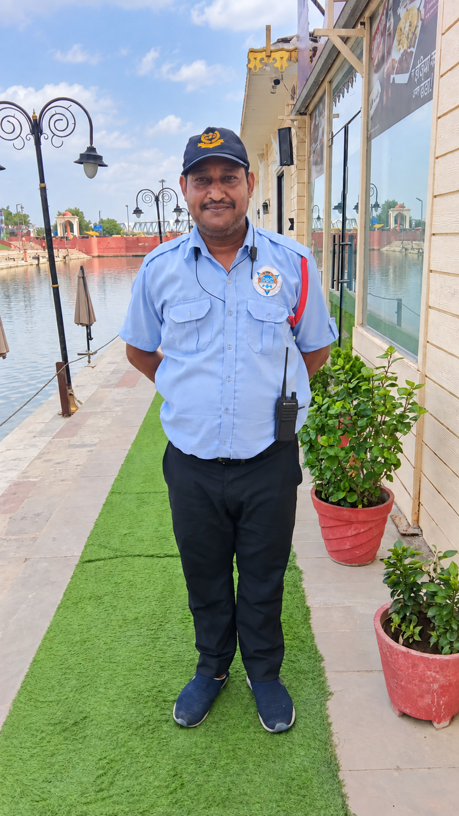 DBC security officer with a walkie-talkie at a hospitality site